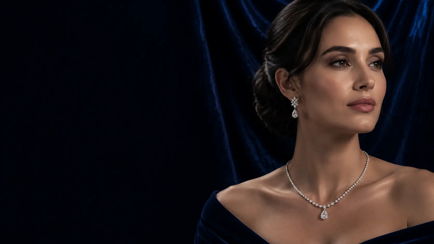 Woman wearing a diamond necklace and drop earrings